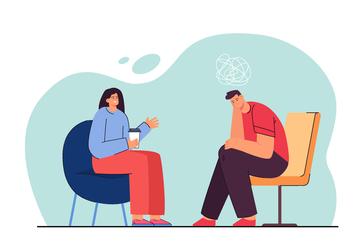Therapist or friend talking to sad man